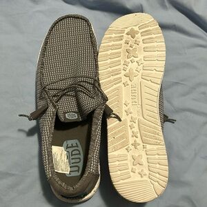 Practically new, never worn outside. Hey Dude men’s tan and blue. Size 14.